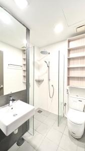 a bathroom with a sink and a toilet and a shower at Suasana Lifestyle Suites by Keystone in Johor Bahru +17 photos
