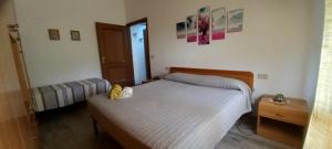 Postel nebo postele na pokoji v ubytování -Casina Vitty-