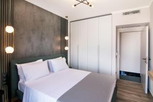 Postel nebo postele na pokoji v ubytování Villas Mandalos
