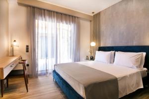 Postel nebo postele na pokoji v ubytování Villas Mandalos