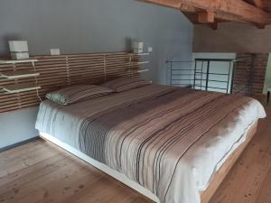 A bed or beds in a room at La gemella