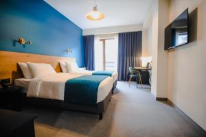 Llit o llits en una habitació de Suatis Resort Kazbegi