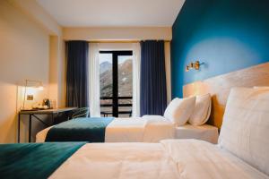 Llit o llits en una habitació de Suatis Resort Kazbegi