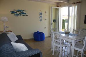 a living room with a couch and a table at Luigi Apartments&Rooms in Pula