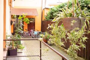 a bicycle is parked in a courtyard of a house at 2- posteľová izba s kúpeľňou a kuchynkou RIŠKO v PENZION TRSTENÁ in Trstená +4 photos