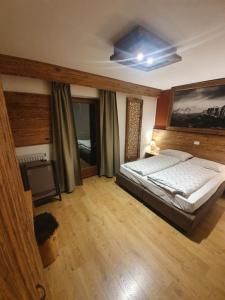 Postel nebo postele na pokoji v ubytování Garni Eden Bed and breakfast