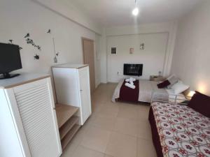 Postel nebo postele na pokoji v ubytování Maisonette In Paradisos 1