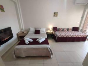 Postel nebo postele na pokoji v ubytování Maisonette In Paradisos 1