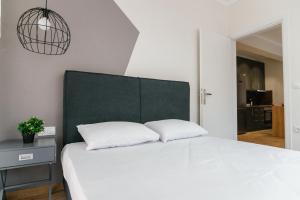 Posteľ alebo postele v izbe v ubytovaní STAMATINA'S LUXURY APARTMENTS (DELUXE SUITE)