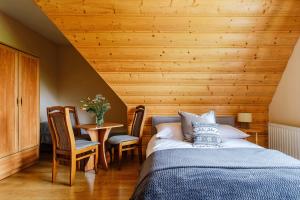 Postel nebo postele na pokoji v ubytování Pokoje i apartament z widokiem na Tatry