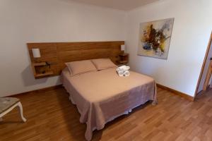 Postel nebo postele na pokoji v ubytování La Casa de Carlitos
