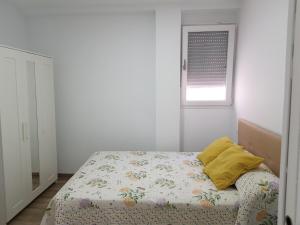 Кровать или кровати в номере APARTAMENTO BIOPARC