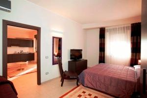 Postel nebo postele na pokoji v ubytování Hotel Massimino