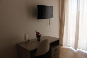 TV o dispositivi per l'intrattenimento presso Guest House Nonna Angela