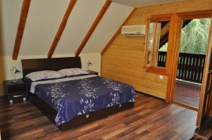 מיטה או מיטות בחדר ב-Casa Agapie