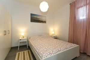 Posteľ alebo postele v izbe v ubytovaní Golden Island Apartments