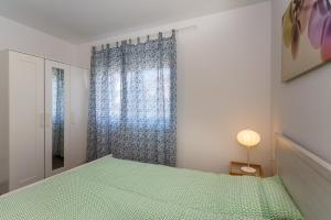 Posteľ alebo postele v izbe v ubytovaní Golden Island Apartments