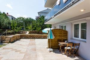 Vonkajšia záhrada v ubytovaní Golden Island Apartments