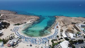 an aerial view of a beach and the ocean at Anonymous Beach Hotel (Adults 16+) in Ayia Napa