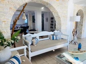 a living room with a couch and a table at Alkyon Hotel in Parikia