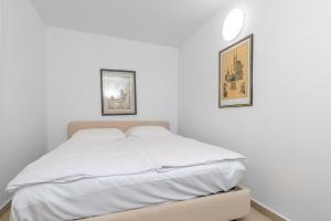 Postel nebo postele na pokoji v ubytování Apartman Lea