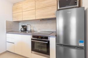 Kuchyň nebo kuchyňský kout v ubytování Apartman Lea