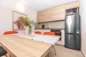 Kuchyň nebo kuchyňský kout v ubytování Apartman Lea
