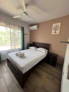 Postel nebo postele na pokoji v ubytování Encantadora Casa Amapolas