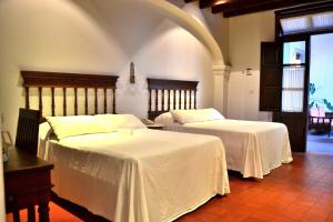 Voodi või voodid majutusasutuse Meson del Alferez Coatepec toas