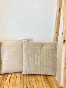 a pillow sitting on top of a wooden floor at Dimora delle Tonnare in Favignana