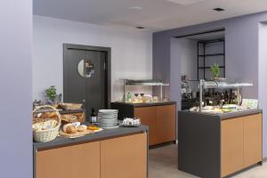 a kitchen with a buffet of food on display at Boutique hotel Lili in Rovinj