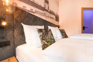 Uma cama ou camas num quarto em Am Paulusbogen