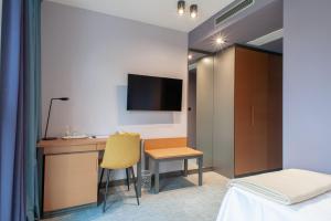 a hotel room with a desk and a bed at Boutique hotel Lili in Rovinj