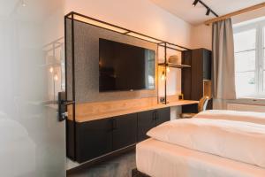 Uma cama ou camas num quarto em Am Paulusbogen