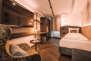 Uma cama ou camas num quarto em Am Paulusbogen