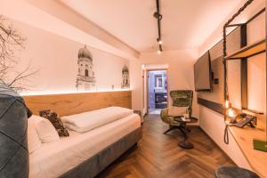 Uma cama ou camas num quarto em Am Paulusbogen