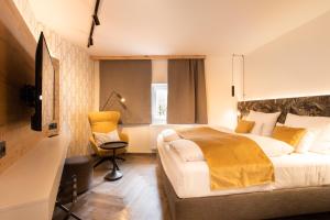 Uma cama ou camas num quarto em Am Paulusbogen