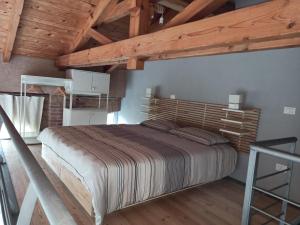 A bed or beds in a room at La gemella