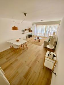 a living room with a table and a couch at Vilamoura - Apartamento Praia e Golf PL I in Vilamoura