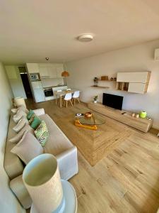 a living room with a couch and a table at Vilamoura - Apartamento Praia e Golf PL I in Vilamoura