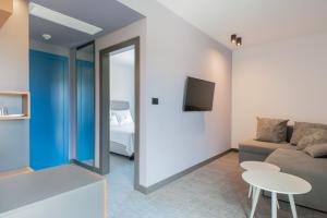 a living room with a couch and a table at Boutique hotel Lili in Rovinj