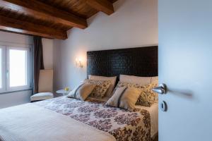 Postel nebo postele na pokoji v ubytování Casa delle sirene
