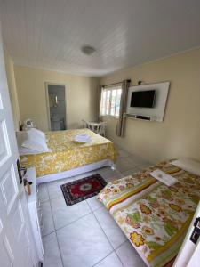 Кровать или кровати в номере Pousada Arcanjo Rafael
