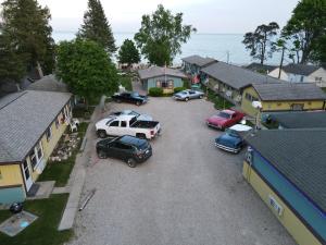 an aerial view of cars parked in a parking lot at Paradise Beach resort in Tawas City