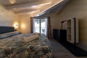 Ένα ή περισσότερα κρεβάτια σε δωμάτιο στο Mughetto Apartment