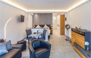 a hotel room with chairs and a table and a bed at Prora Solitaire Panorama 02 in Binz