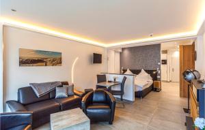 a hotel room with a bed and a living room at Prora Solitaire Panorama 02 in Binz +35 photos