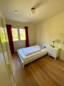 a small bedroom with a bed and a window at Schönes Privatzimmer Region Hannover in Springe