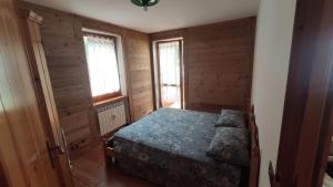 Cama ou camas em um quarto em Appartamento Gressoney-Saint-Jean (Obre Biel) - I Larici