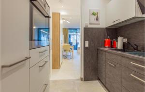 a kitchen with a sink and a counter at Prora Solitaire Panorama 06 in Binz +41 photos